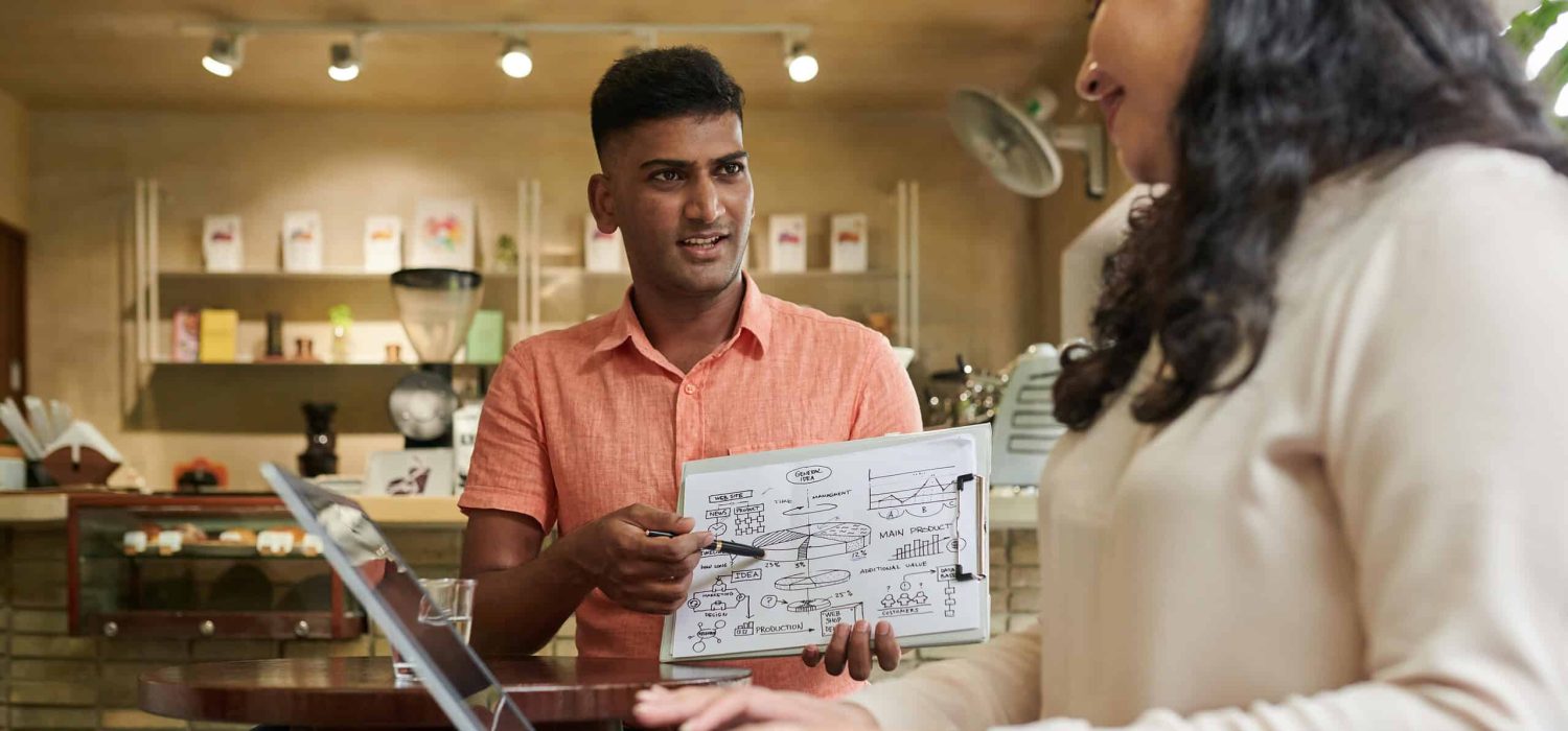 business-colleagues-discussing-chart-2023-11-27-04-50-29-utc-min