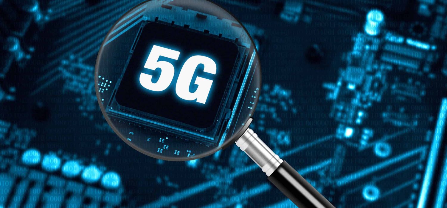 The concept of 5G network with magnifying glass on modern circuit board, high-speed mobile internet and new generation networks technology background