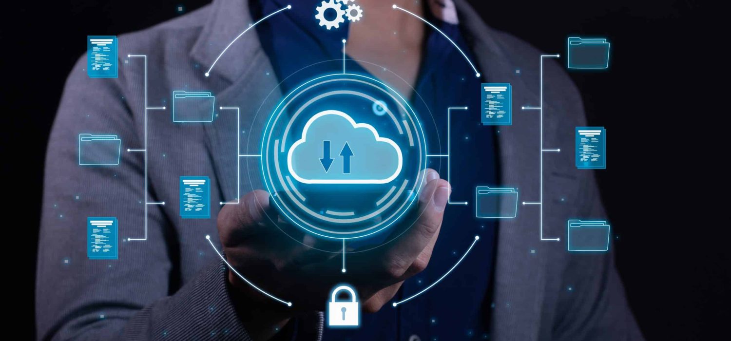 A man employs cloud-based computing on his smartphone to facilitate data transmission, storage, backup, and access